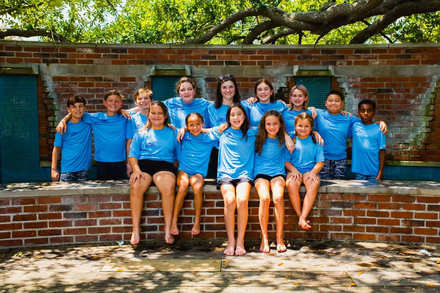 Swimsational Swim School team members in matching team shirts, 2025